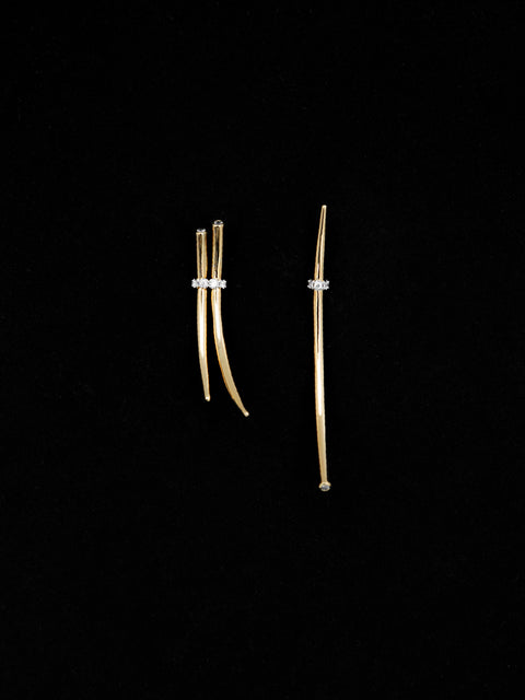 mismatched tabua earrings with crystal detail