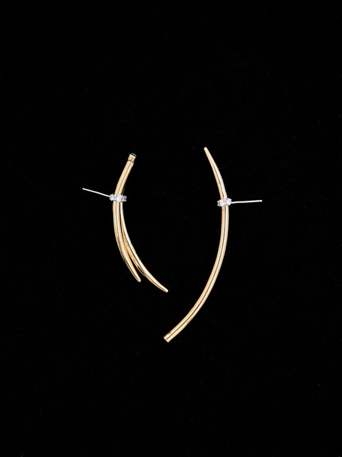 mismatched tabua earrings with crystal detail