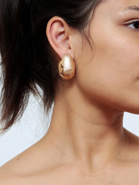 golden ovoid molten earrings