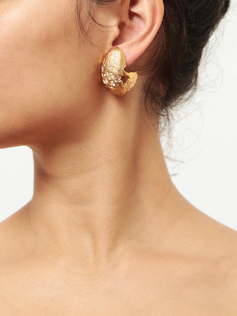 crystallized golden ovoid molten clip on earrings