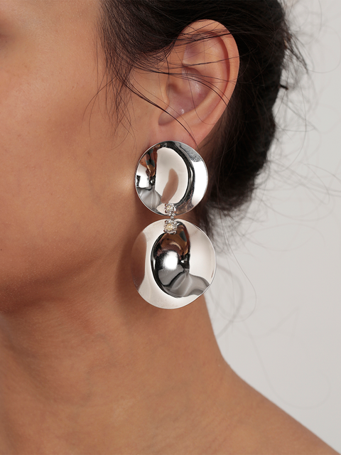 two large waved disc earrings