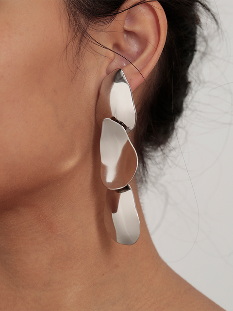 three mobile organic tear disc earrings